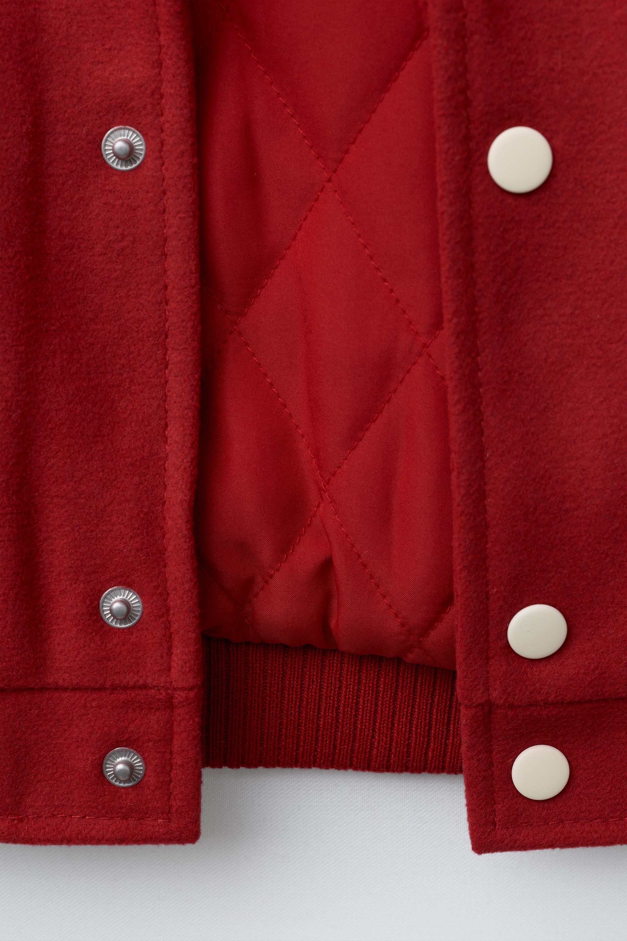 CLOTH BOMBER JACKET WITH FAUX LEATHER SLEEVES AND PATCHES